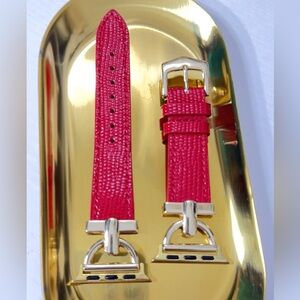 Red leather strap with gold buckle, elegant and comfortable design.